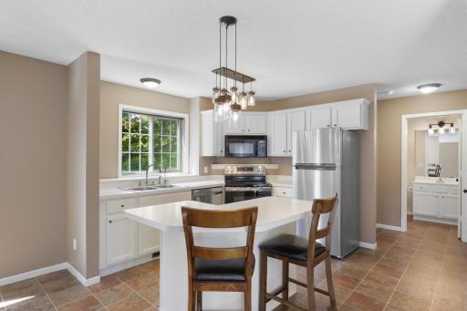 Stainless steel appliances, kitchen island, and large walk in pantry!