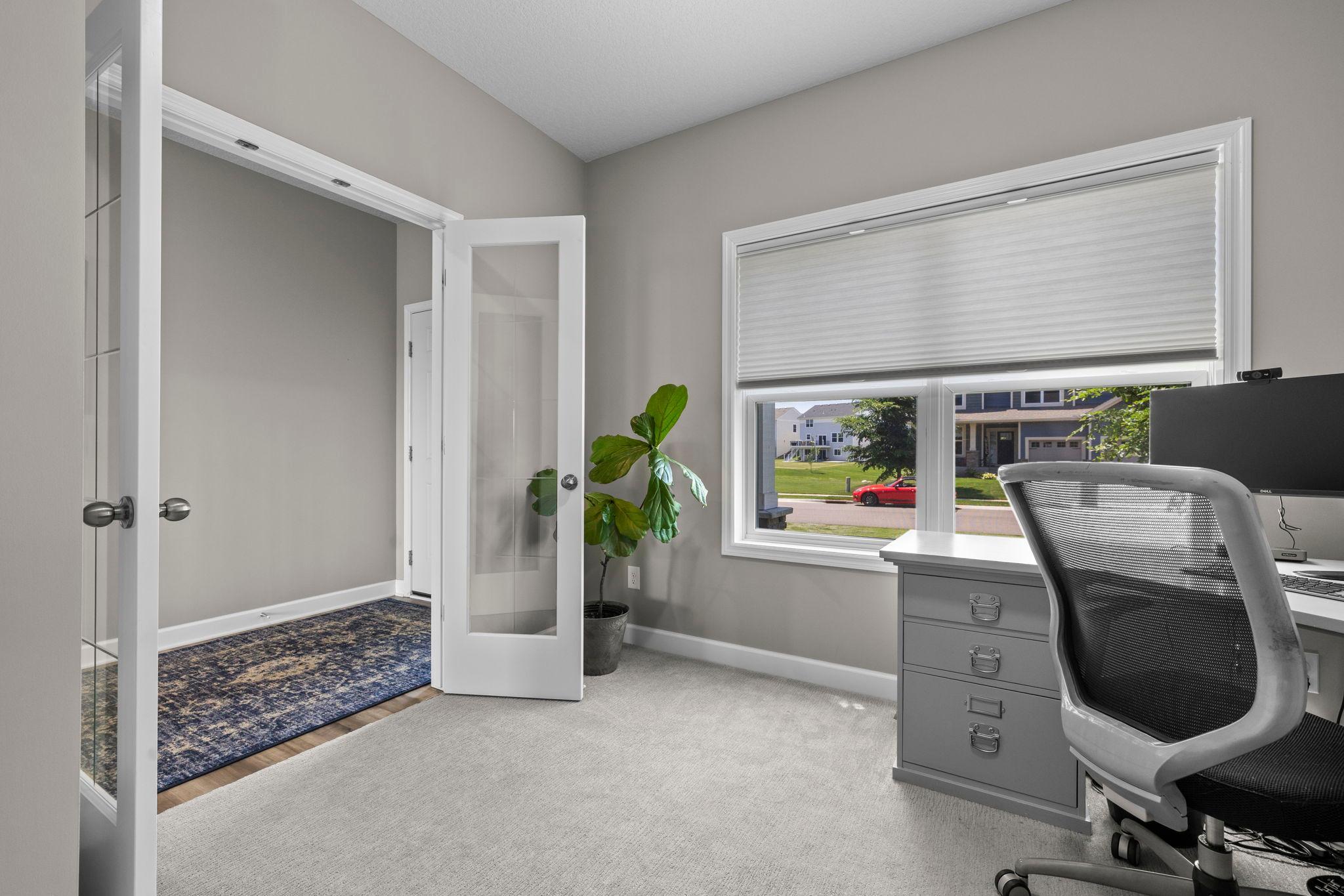 Mainfloor office with double glass french doors
