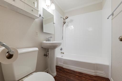 Full bath with reglazed tub.