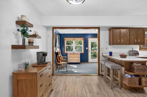 Informal dining area flows directly into the four-season sunroom for easy everyday living.