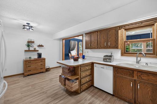 Center peninsula adds additional prep space, storage and casual seating.