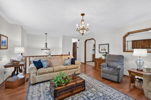 Open sightlines connect the living room to the kitchen and adjoining spaces.