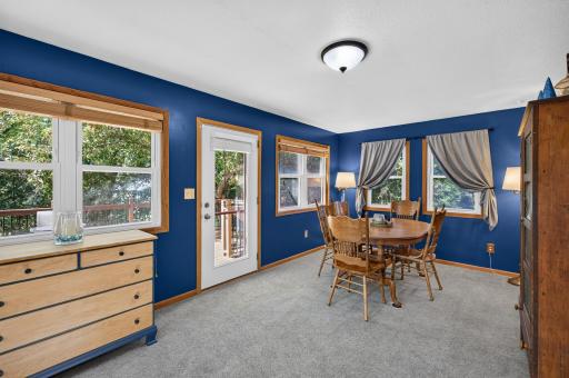 Four-season sunroom overlooks the backyard and provides a wonderful spot for dining or relaxing.