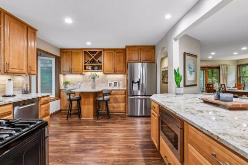 Renovated chef's kitchen with custom cabinetry, granite and stainless appliances