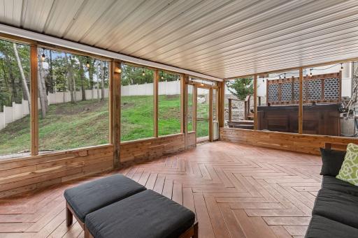 Large screened porch walks out to the backyard and pool/spa