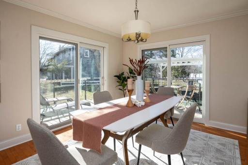 Dining room has 2 sliding patio doors to a deck that overlooks the back yard