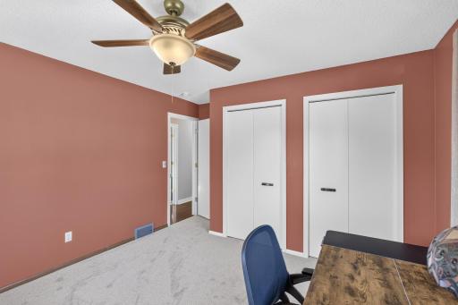 Comfortable bedroom with generous closet storage, ceiling fan and plenty of natural light