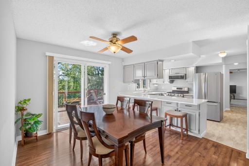 Warm hardwoods and sliding door leads to expansive deck replaced in 2020