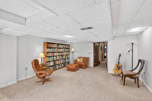 Expansive lower level offers exceptional versatility, with room to create distinct areas for a home office, reading nook or additional gathering area