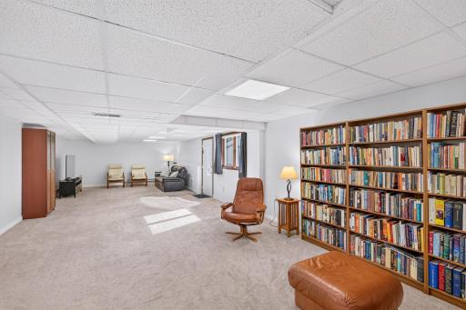 Expansive lower-level recreation room offers exceptional flexibility for entertaining, relaxing, hobbies or a home library