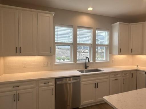 Expansive island with quartz surface offers additional prep space, bar seating, and a stylish centerpiece to your new kitchen.