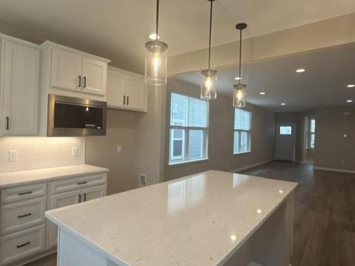Open-concept design allows seamless flow from the kitchen to dining and living spacesâideal for hosting and connection.
