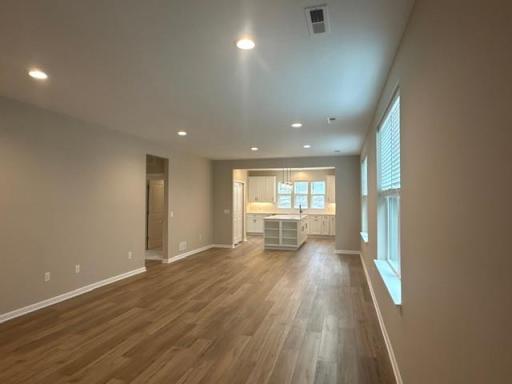 Open floorplan creates a seamless connection between the family room, kitchen, and dining areasâideal for entertaining and family togetherness.