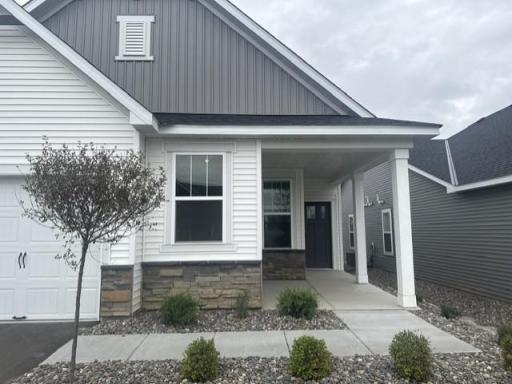 Welcome to your new home! Smooth, clean walkways guide visitors to the front door, bordered by tasteful landscaping that enhances the homeâs inviting exterior.