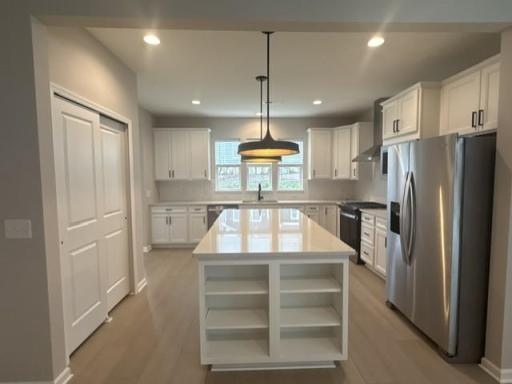Bright and spacious kitchen featuring ample cabinetry, sleek countertops, and a functional layoutâperfect for everyday living and entertaining.