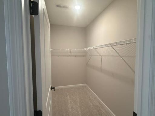 Open and Spacious Primary Bedroom Closet with Lots of Room for Your Everyday Needs.