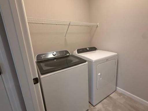 Spacious and well-organized laundry room designed for everyday ease, featuring ample space for folding, sorting, and storage.