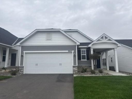 Striking curb appeal with clean lines and modern architectural design. The well manicured landscaping complements the sleek exterior finishes, creating a welcoming and polished first impression.