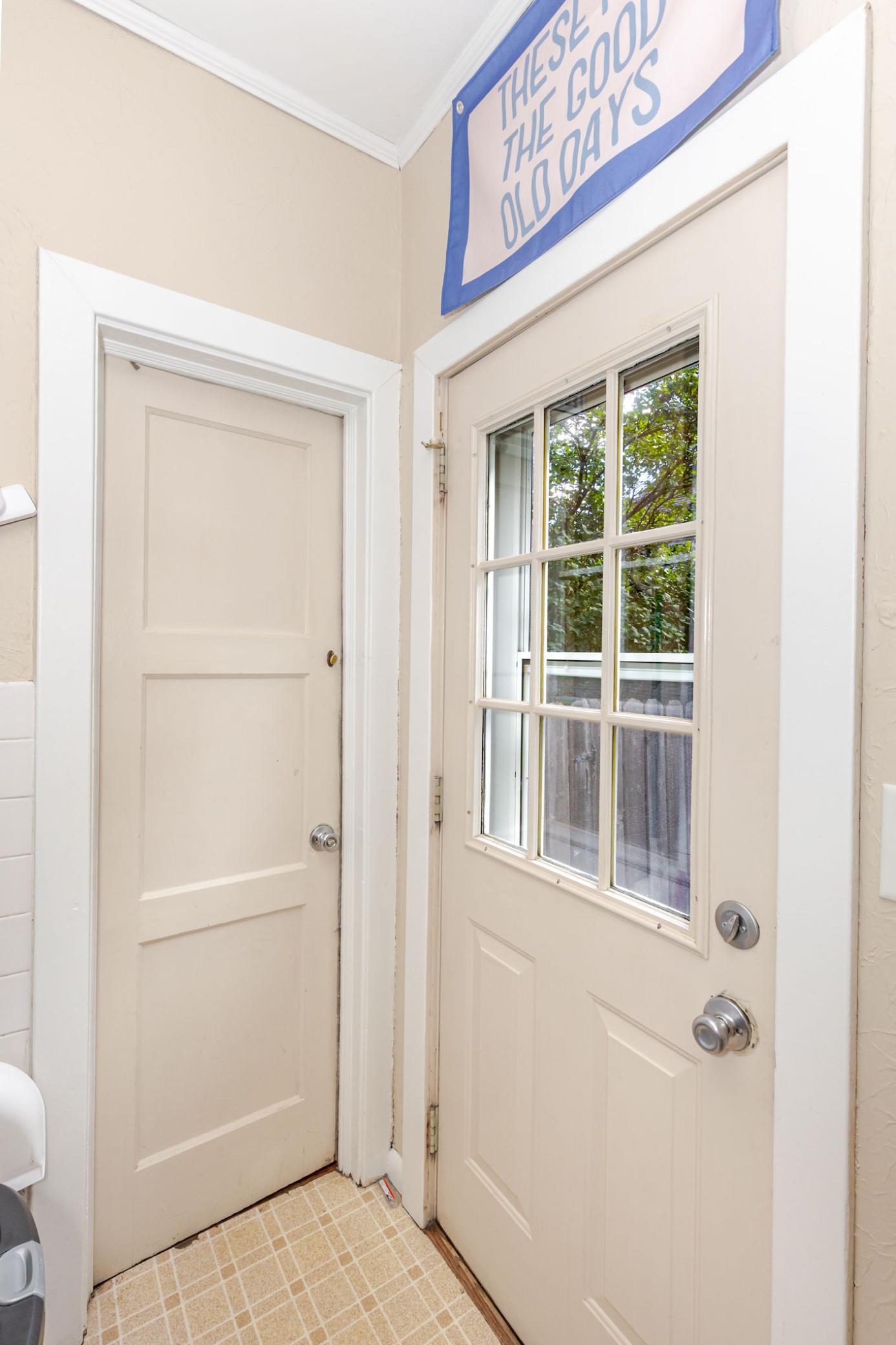 Side door and entrance to garage