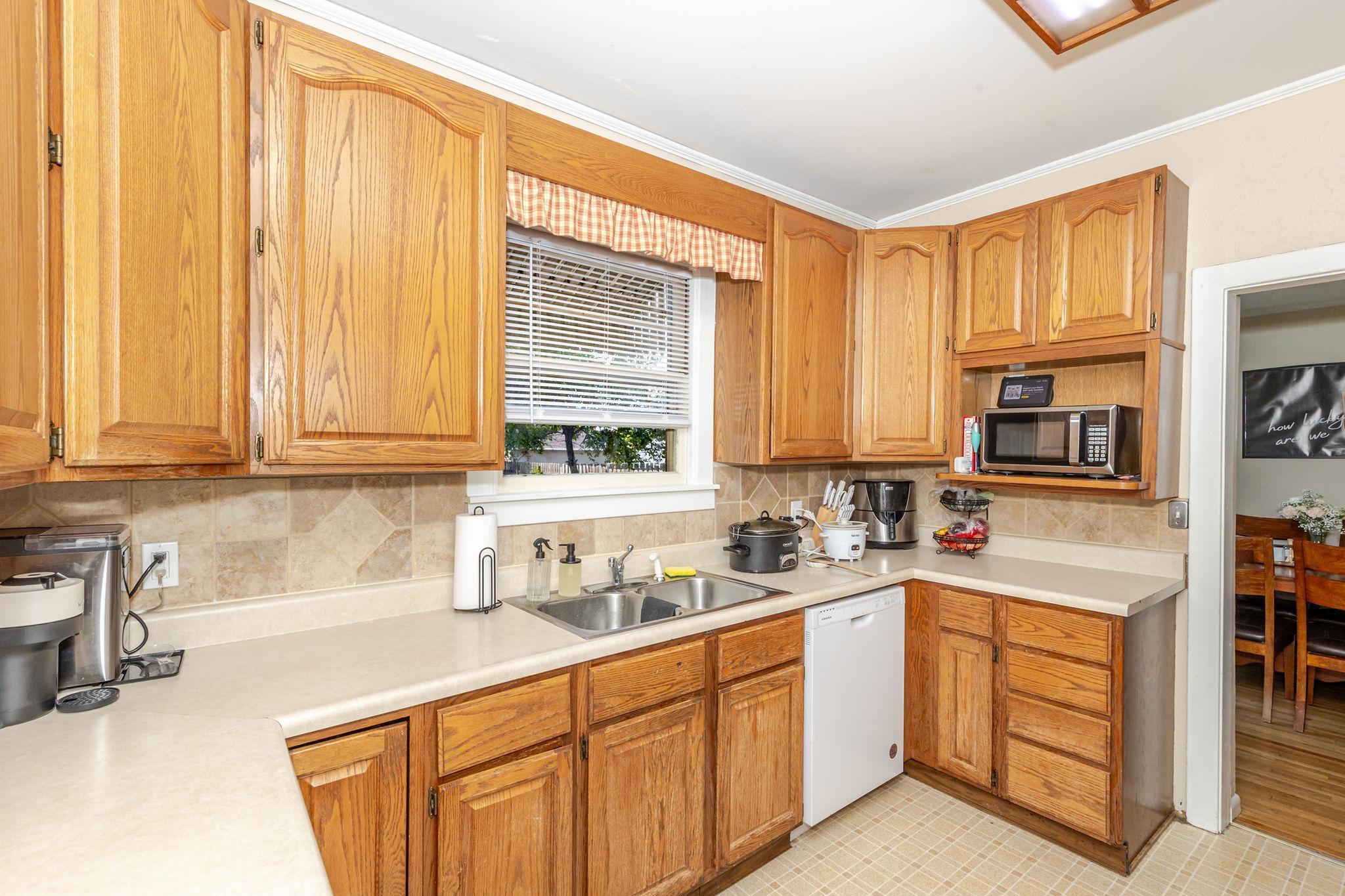 Kitchen w/ window to backyard