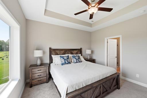 Primary bedroom - photos are of a staged home with same floorplan. Colors and selections may differ.