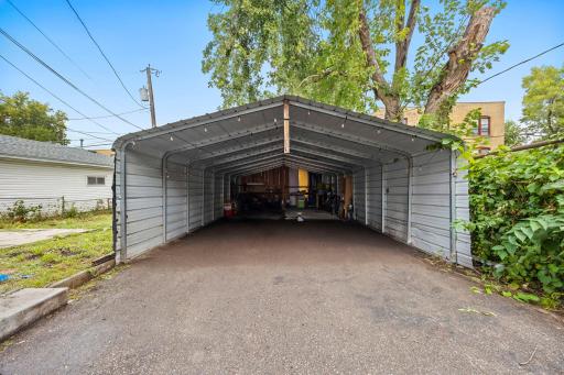 Spacious 4-Car Carport (approx. 36 × 20). Buyer to verify measurements.