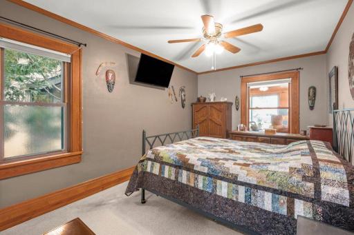 Another view of bedroom one - note the huge windows, ceiling fan and beautiful woodwork.