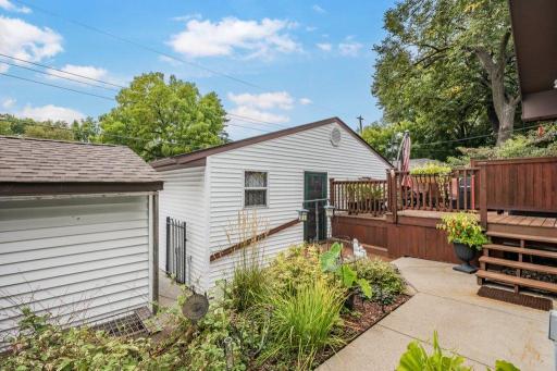 This is a view of the garage, shed, and steps to the back door.