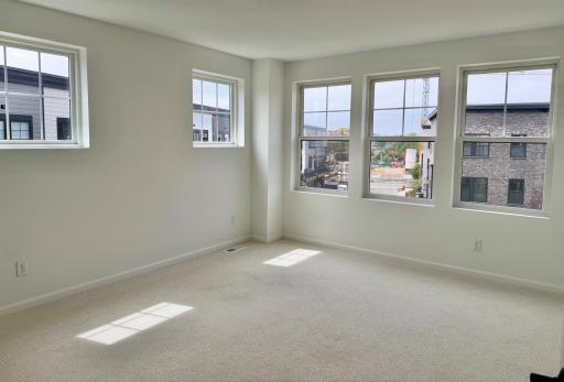 Primary bedroom with ensuite bathroom and 2 closets.