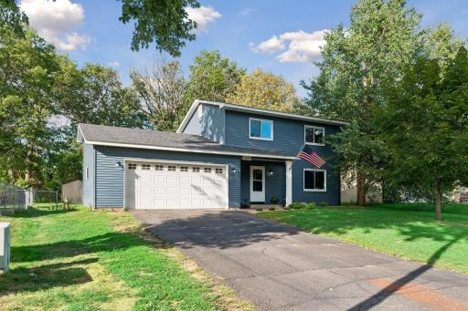 Attached two-car garage and paved driveway. Roof and siding replaced in 2022.