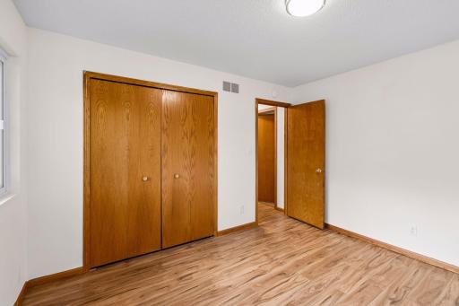 Bedroom three includes a wide closet with bifold doors.
