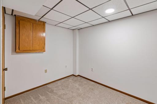 Additional finished lower-level room offers space for hobbies or a home office.
