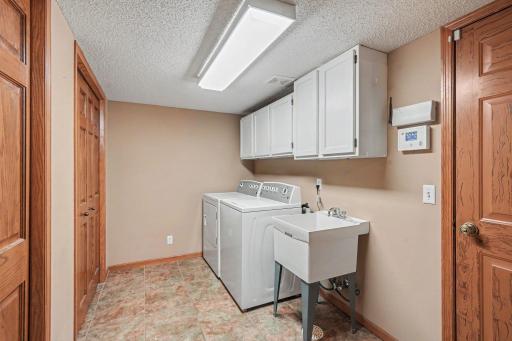 Main level laundry off the garage with two closets
