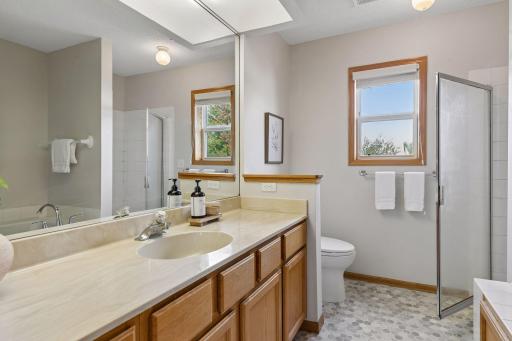 Primary bath with walk in shower and separate tub.