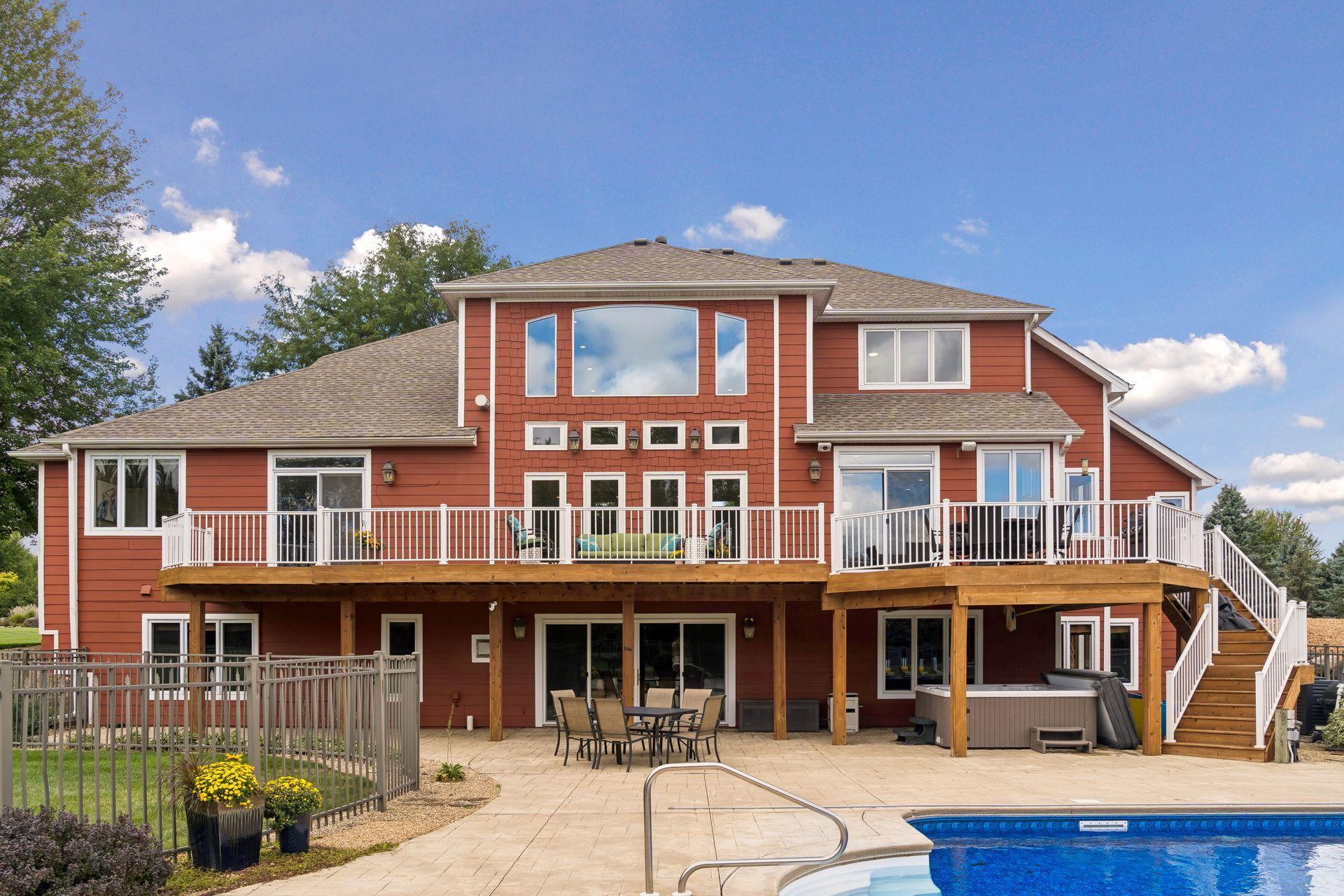 Back of House with Deck and Patio