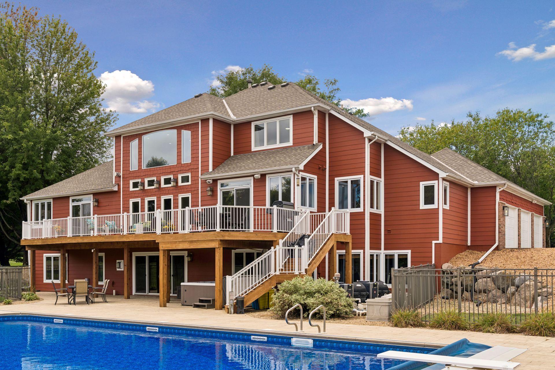 Back of House with Deck and Patio