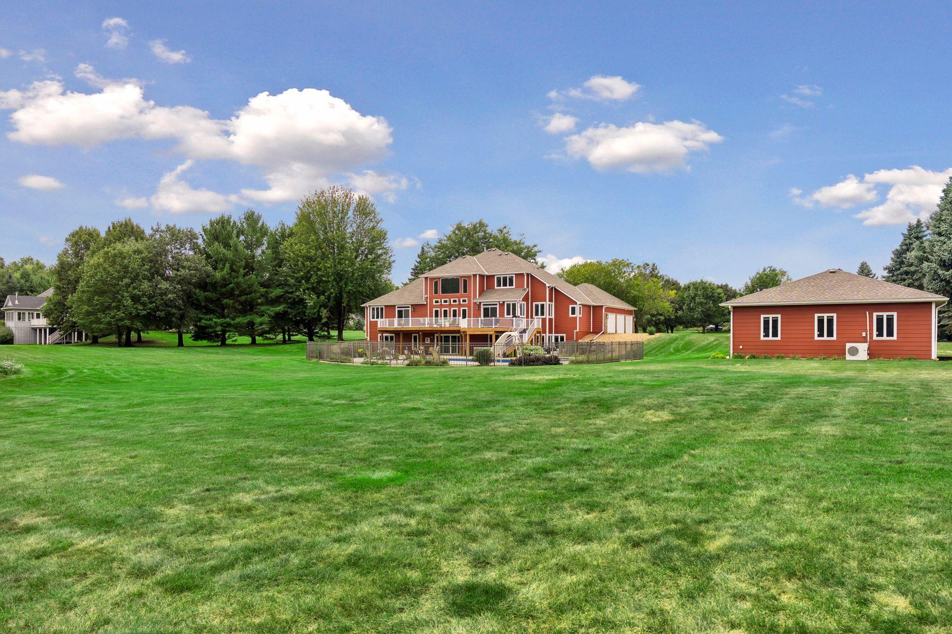 Back of House with Deck and Patio