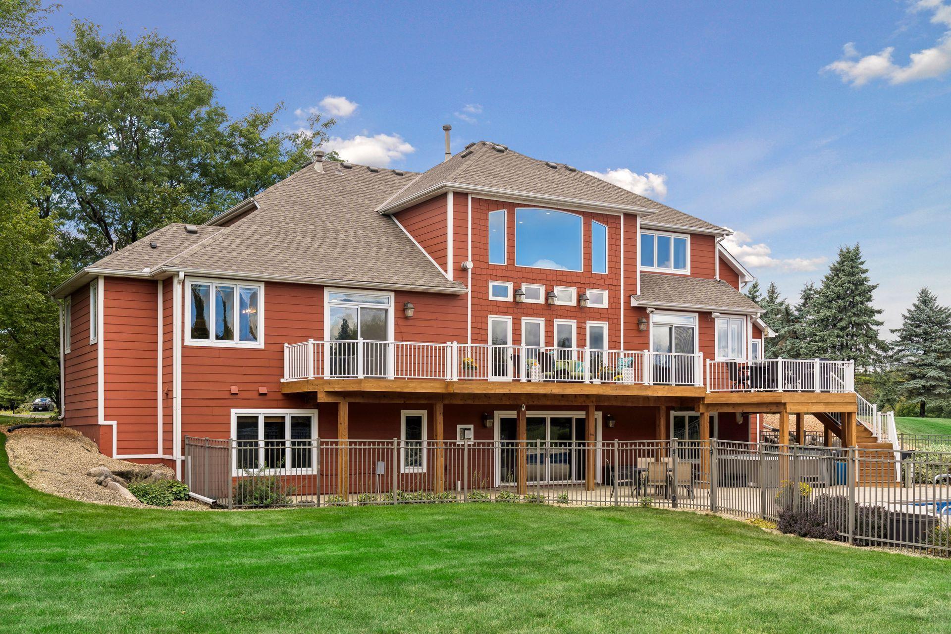 Back of House with Deck and Patio