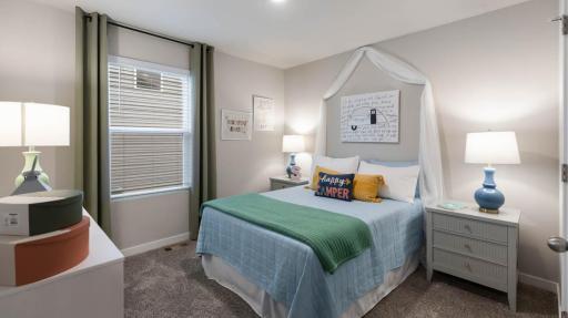 Main floor secondary bedroom #2. *Photo of similar home. Virtually staged.