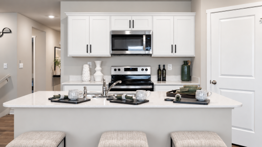 Cook, entertain, and connect in this beautifully designed kitchen with a large island and plenty of workspace. *Photo of similar home. Virtually staged.