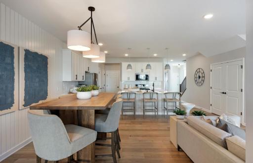 Conveniently located off the kitchen we find the dining room! Perfectly sized to accommodate any table or set up you could want! Photo of model home.