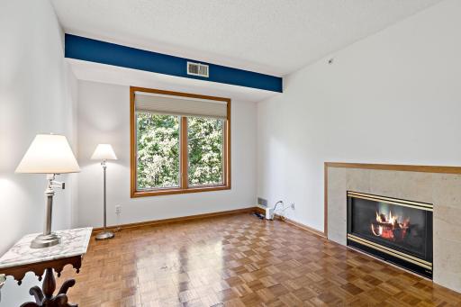Second Bedroom, Parquet Hardwood Floors, Double-sided Heat & Glo Fireplace, Picture Window