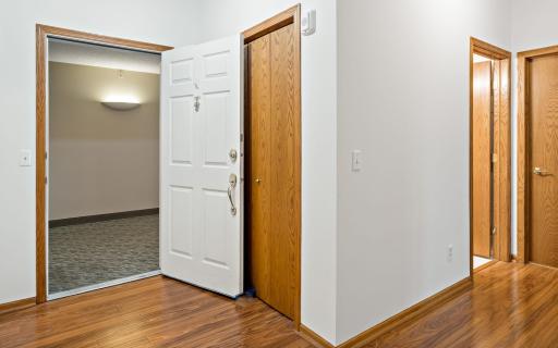 Open Foyer, with a Coat Closet, viewing the Full Bath & Laundry Room