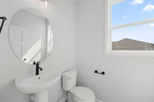 For representational purposes only. The powder bath provides that necessary main floor bathroom, conveniently located off the mudroom.