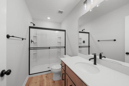 For representational purposes only. The lower level bathroom is spacious and convenient.