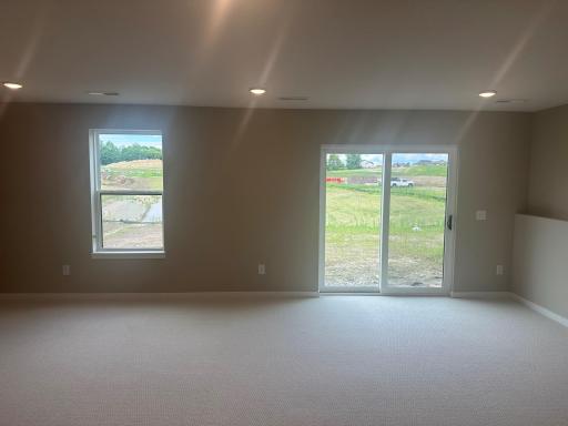 Finished Lower-Level family room as shown in 8852 63rd St. S.