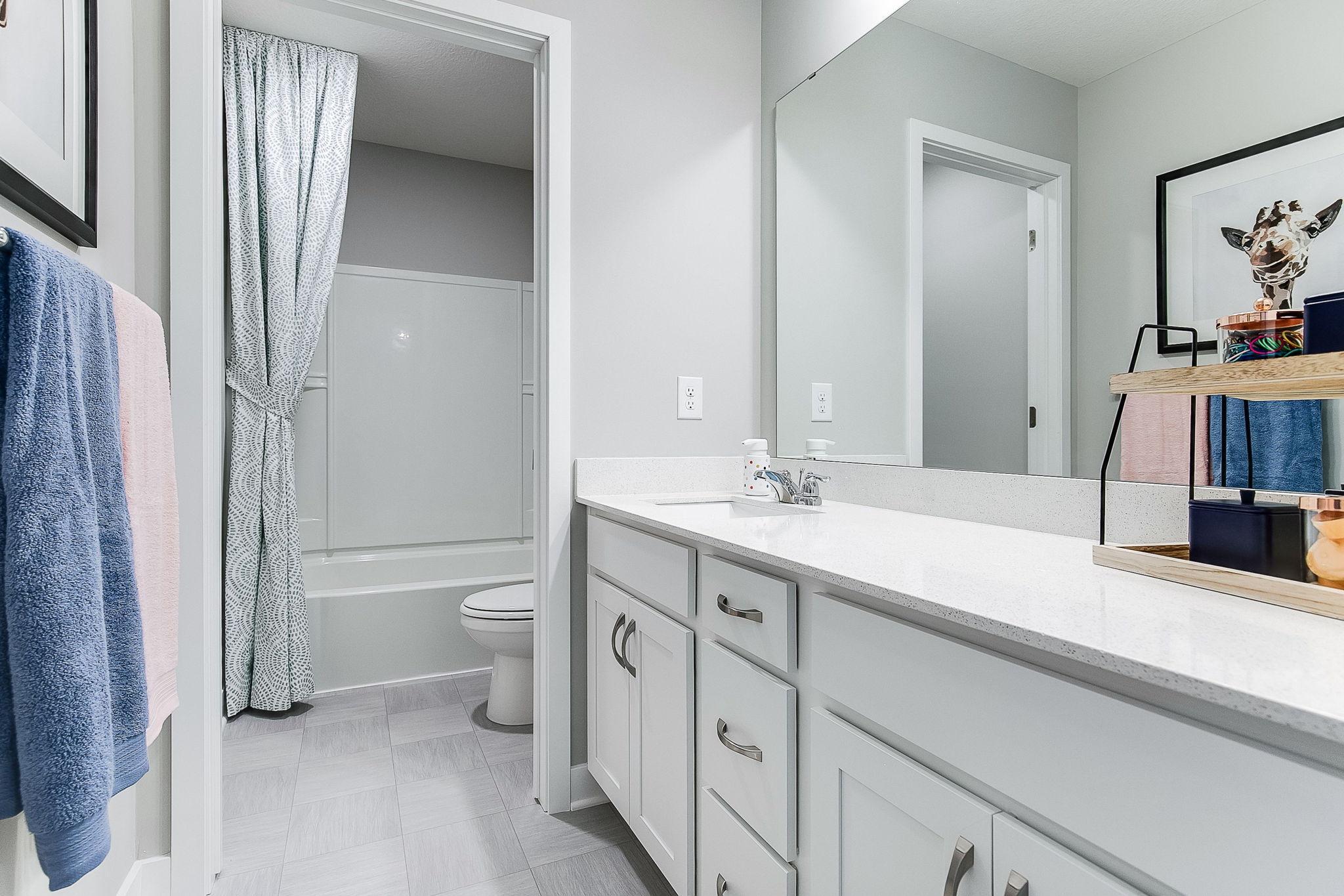 Upstairs hall bath features privacy between the vanity and shower. *Picture is of model home; actual finishes may vary.