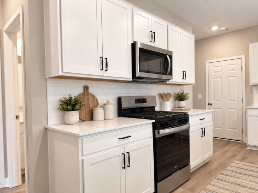 Stainless steel appliances throughout. *Photo is of similar home. Virtually staged.
