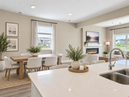 The oversized island overlooks the dining and living areas, keeping everyone connected while entertaining or enjoying everyday life. *Photo is of similar home. Virtually staged.
