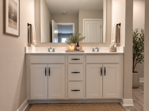 Dual vanities provide plenty of space to get ready and stay organized. *Photo is of similar home. Virtually staged.